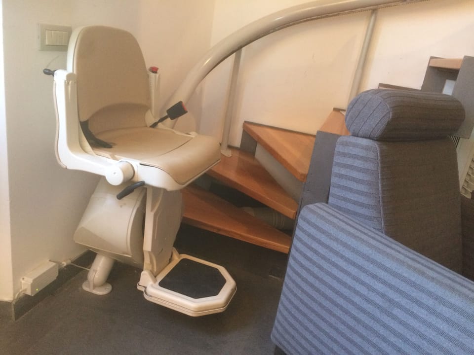 Lift seat on the staircase to the bedrooms