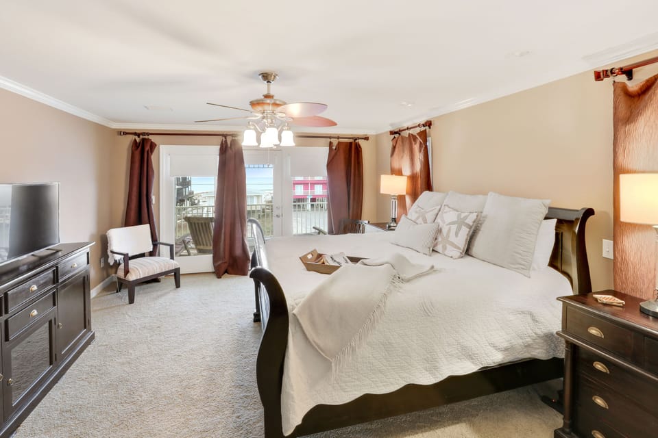 Master bedroom with king bed and balcony with views of the gulf.