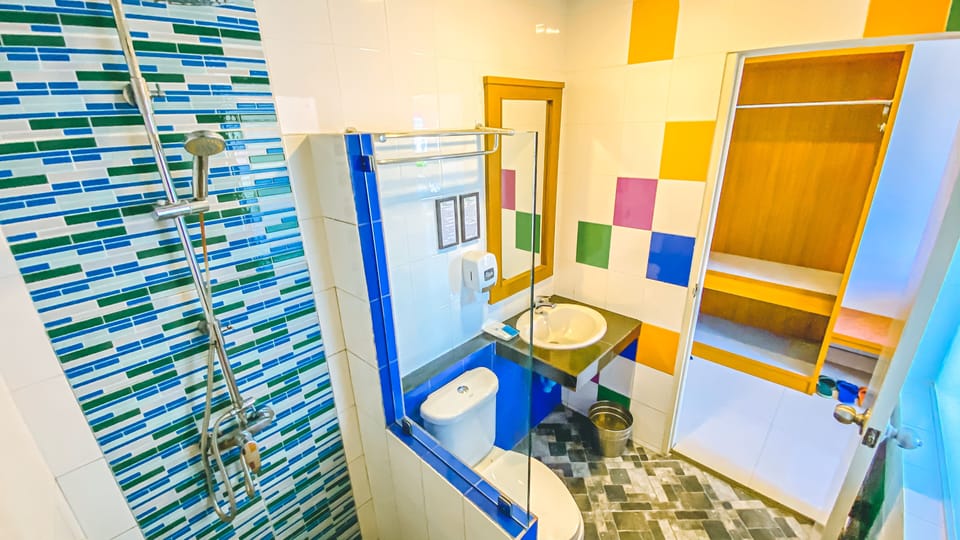 Shower, free toiletries, slippers, towels