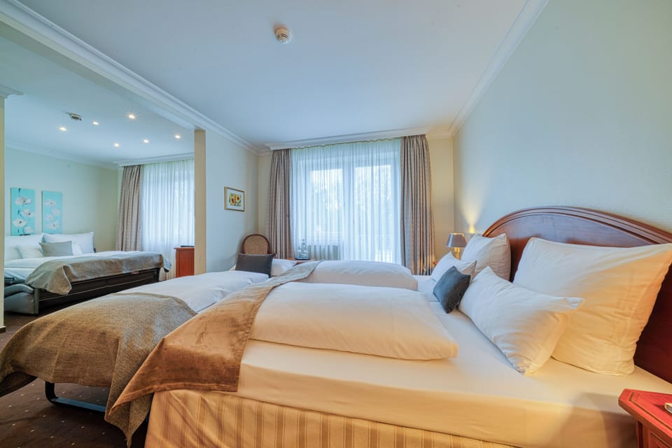 Standard Triple Room | In-room safe, desk, blackout drapes, soundproofing