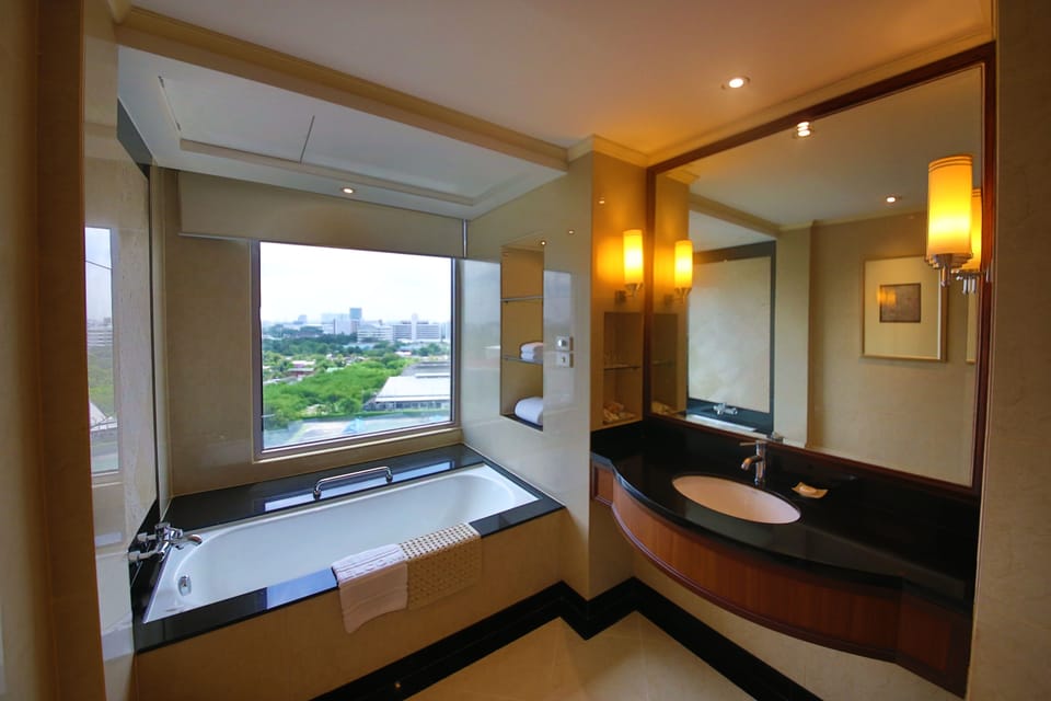 Executive Deluxe Room, Bathtub | Bathroom | Free toiletries, hair dryer, bathrobes, slippers