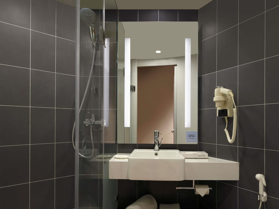Shower, eco-friendly toiletries, hair dryer, towels