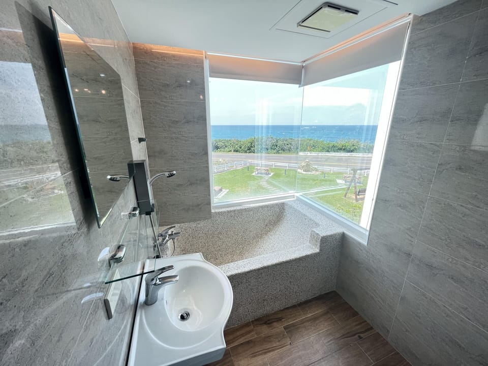 Deluxe Double Room, Bay View | Bathroom | Separate tub and shower, hair dryer, slippers, towels