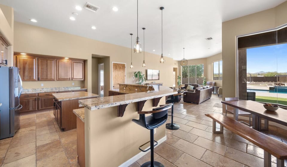 [Kitchen] Large open kitchen with counter seating and dining