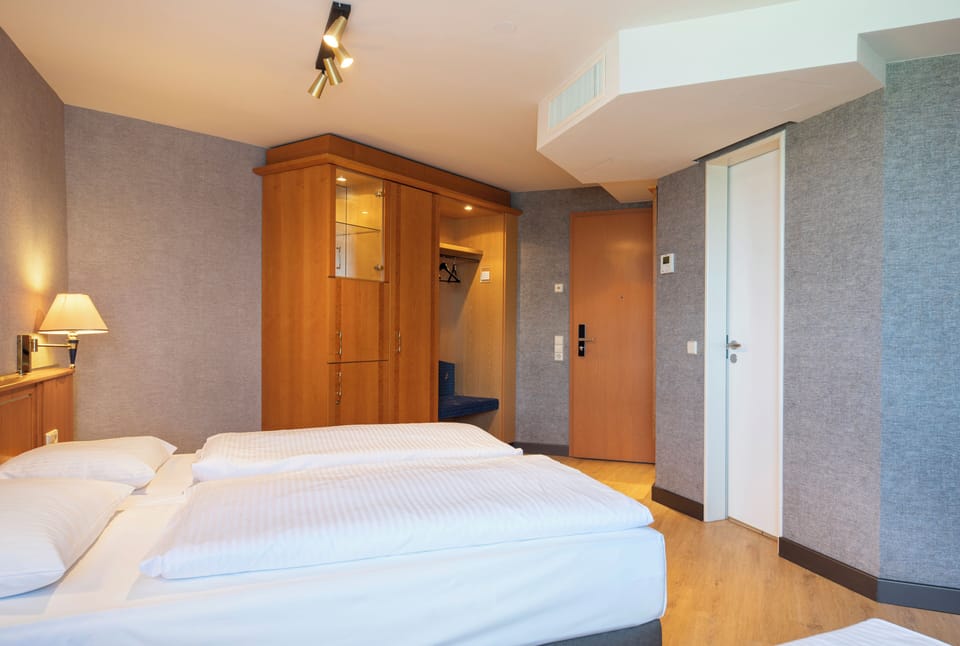 Economy Twin Room | Desk, laptop workspace, blackout drapes, iron/ironing board