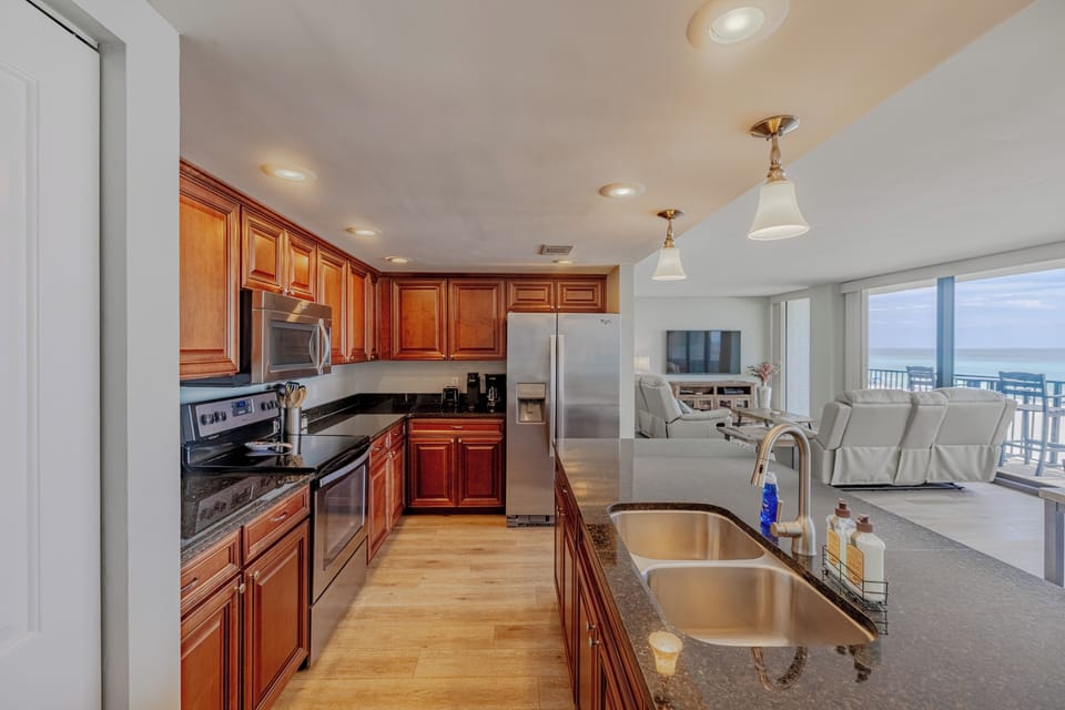 Enjoy cooking with a fabulous view! Full sized washer and dryer off the kitchen