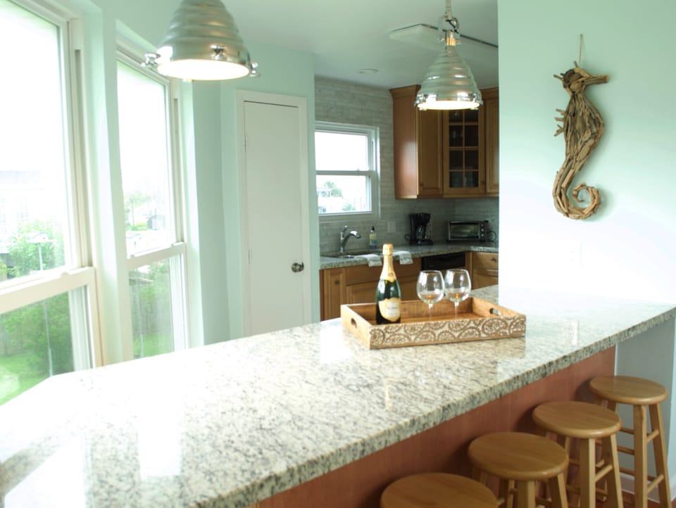 Ample prep space and seating for 6 at the bar.