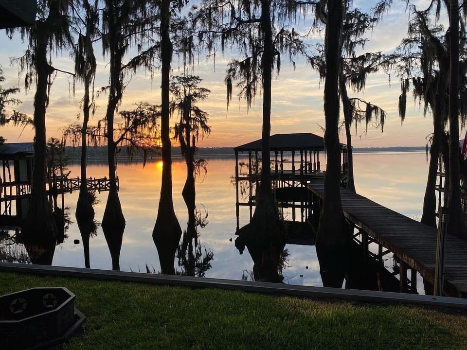 Sunrise over Lake Louisa from the back porch of our lake house.