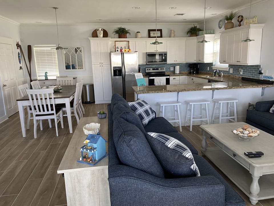 Combined first level living room, kitchen and dining for the family to enjoy.