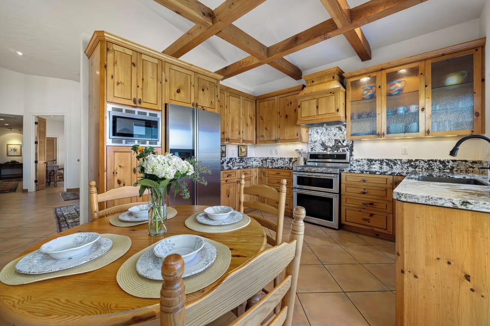 Beautifully designed pine kitchen with striking beam details and rustic charm 