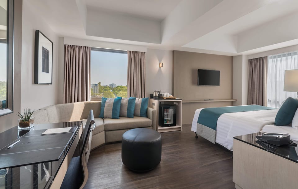 1 King Bed, Large Room with Living Area | Minibar, in-room safe, desk, iron/ironing board