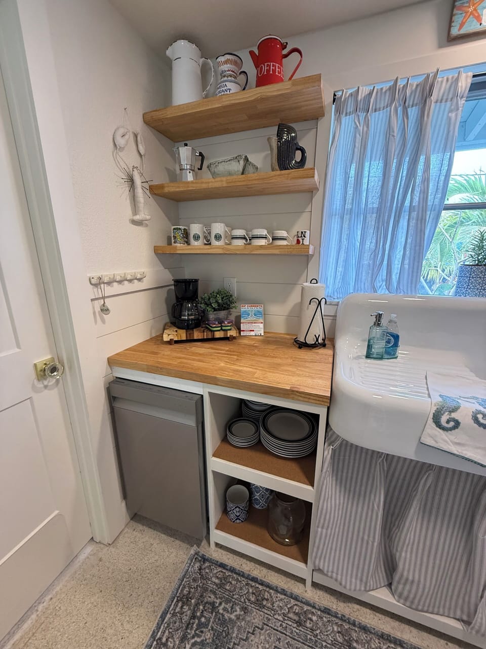 Dishwasher and door leading into garage;