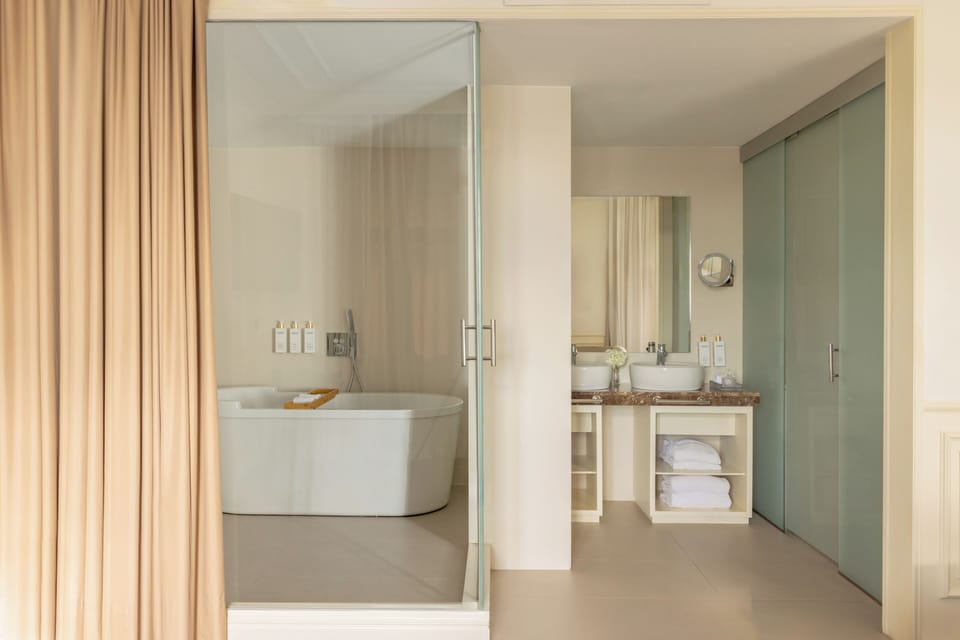 Designer toiletries, hair dryer, bathrobes, slippers