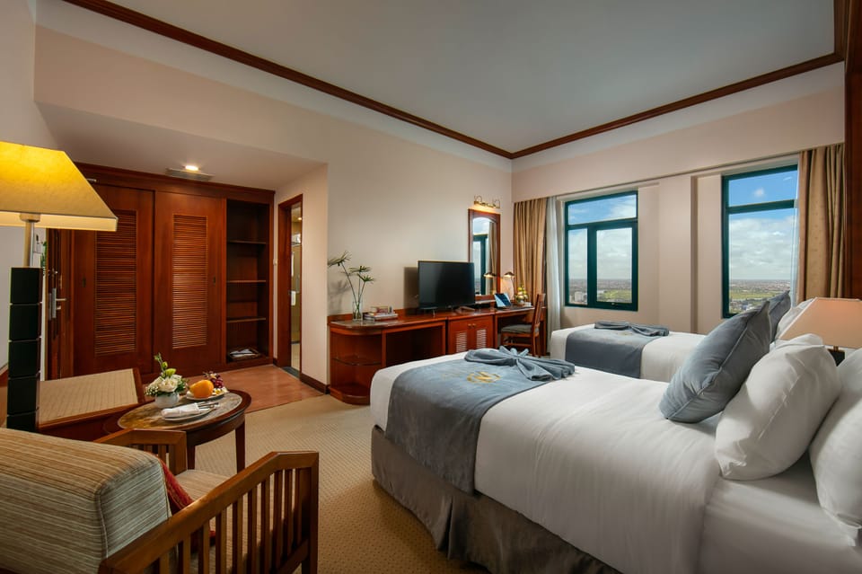 Deluxe Double or Twin Room | Minibar, in-room safe, desk, blackout drapes