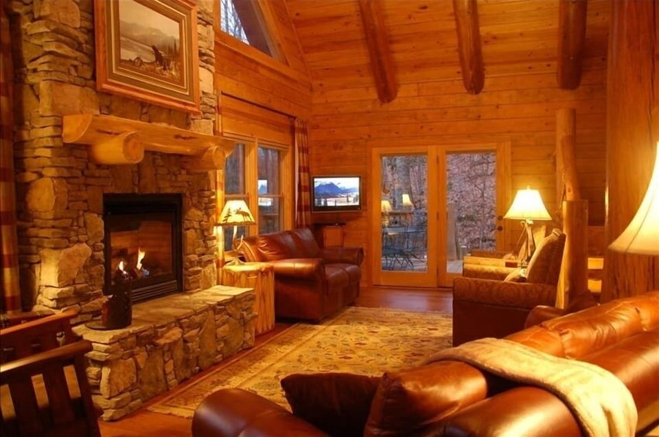 The Great Room 25-foot ceiling and massive stone fireplace.