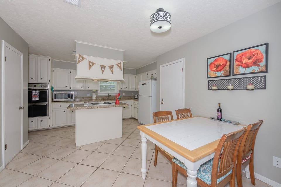 Super roomy kitchen with granite countertops & numerous appliances