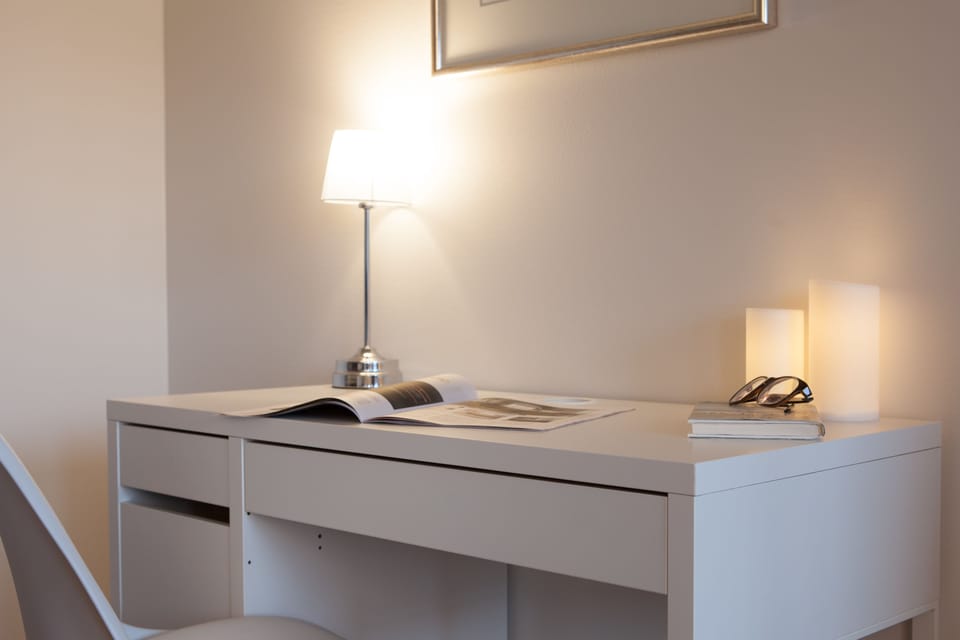 One-bedroom apartment with balcony | Living area | Flat-screen TV