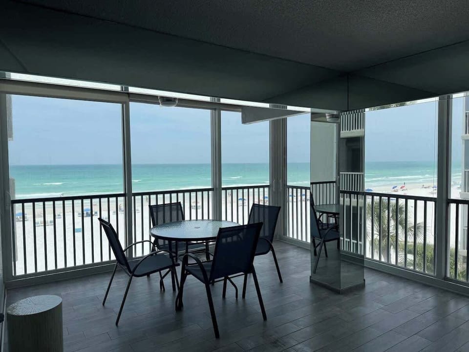 Enclosed lanai with sliders so you can enjoy the ocean breeze