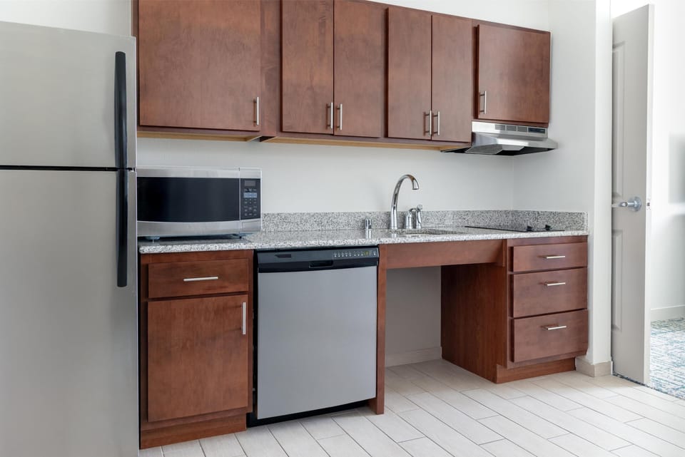 Suite, 1 King Bed, Accessible, Bathtub | Private kitchen | Full-size fridge, microwave, dishwasher, coffee/tea maker