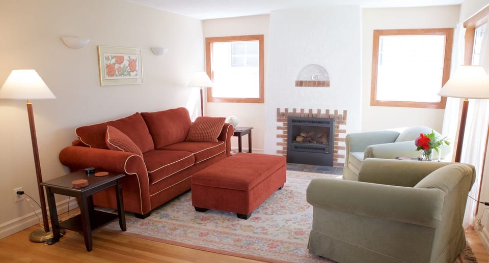 Main floor living room with gas fireplace.