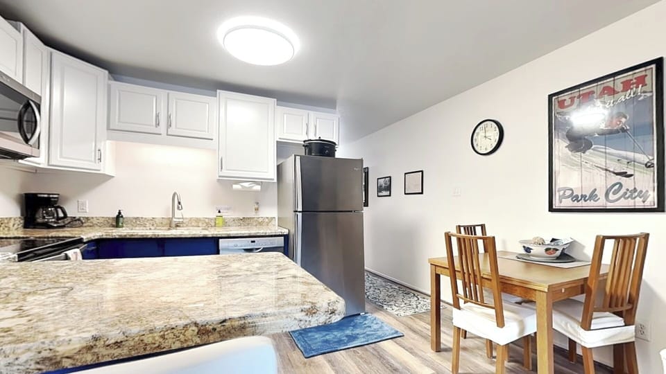 Kitchen with Granite & stainless steel appliances, expandable dining table for 6