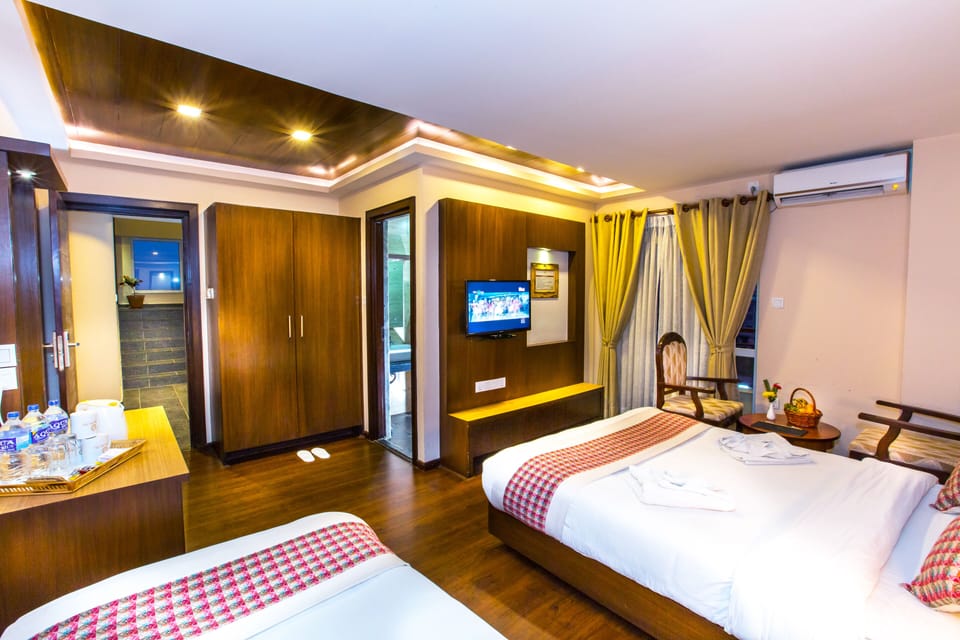 Family Room, Balcony, City View | Premium bedding, minibar, in-room safe, individually decorated