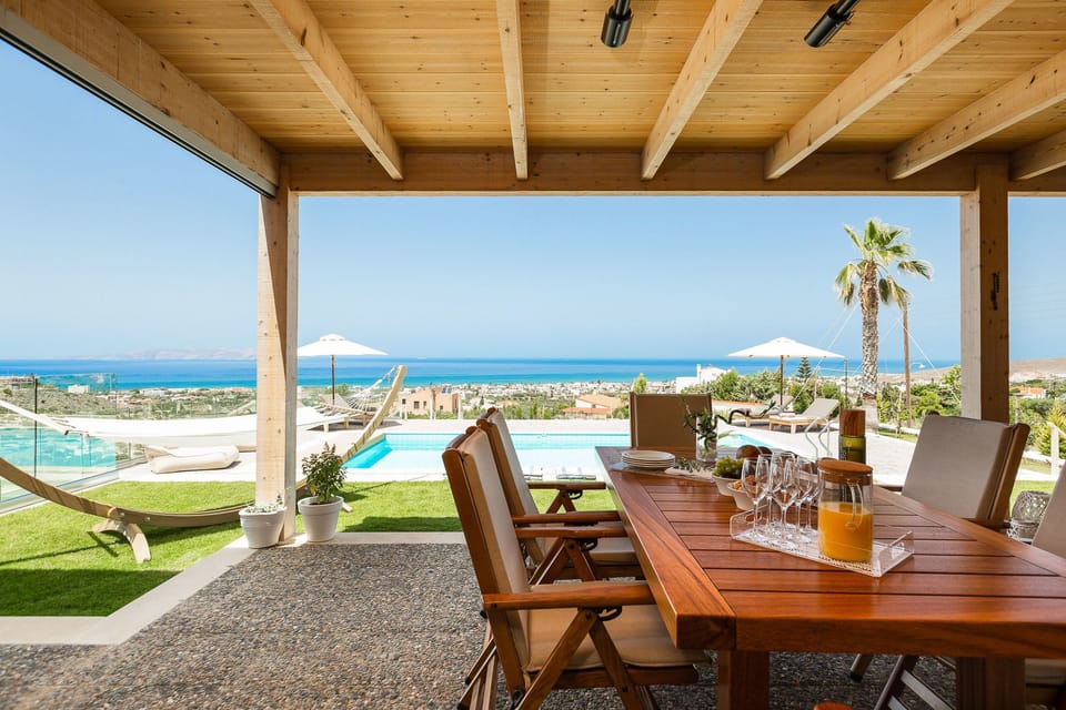 Outdoor pool, an infinity pool, pool umbrellas, sun loungers