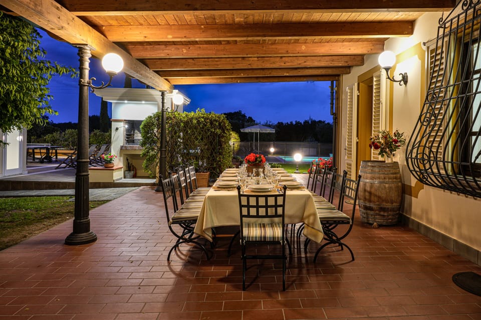 Veranda with a large table for 12 guests at Villa Colombai
