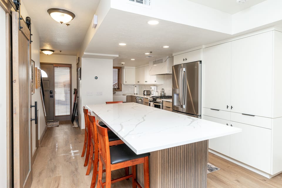 Newly Renovated Kitchen - all new GE appliances. Island seating for 6.