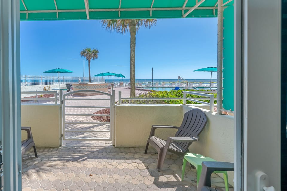 Private patio directly adjacent to pool deck
