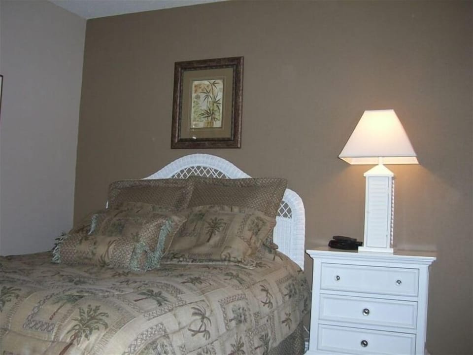 Guest Bedroom in Tropical Decor with new paint & carpet @ Edgewater Beach Resort