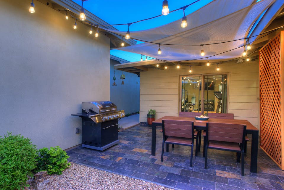 Private dining on slate patio. Edison patio lighting with flick of a switch.
