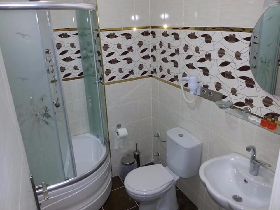 Shower, free toiletries, hair dryer, slippers