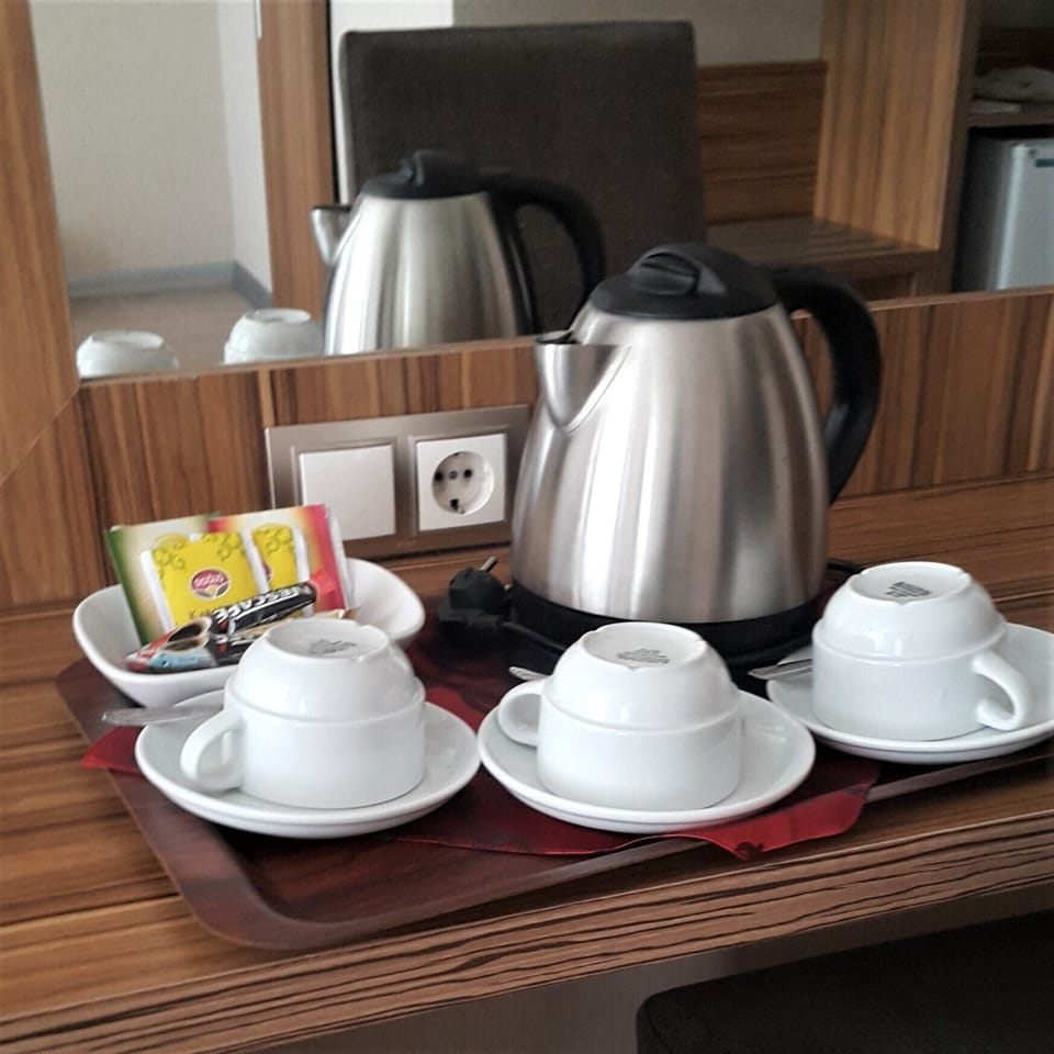 Family Triple Room | Free minibar items, in-room safe, desk, laptop workspace