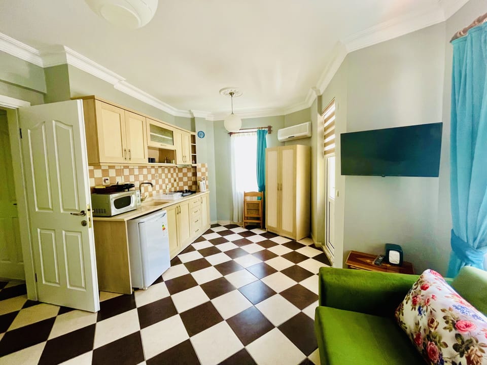 Apartment, 1 Bedroom | Desk, iron/ironing board, free cribs/infant beds, bed sheets