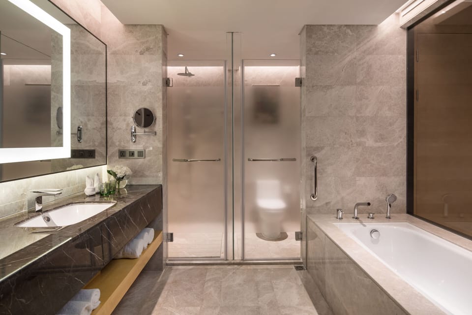 Suite, 1 Bedroom, Lake View | Bathroom | Separate tub and shower, free toiletries, hair dryer, slippers