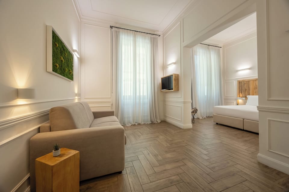 Junior Suite | Living area | 42-inch flat-screen TV with satellite channels, TV