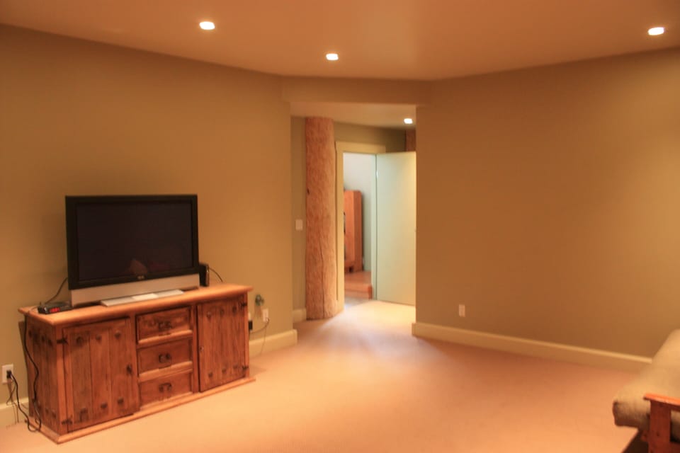 Downstairs media room with large flat screen TV