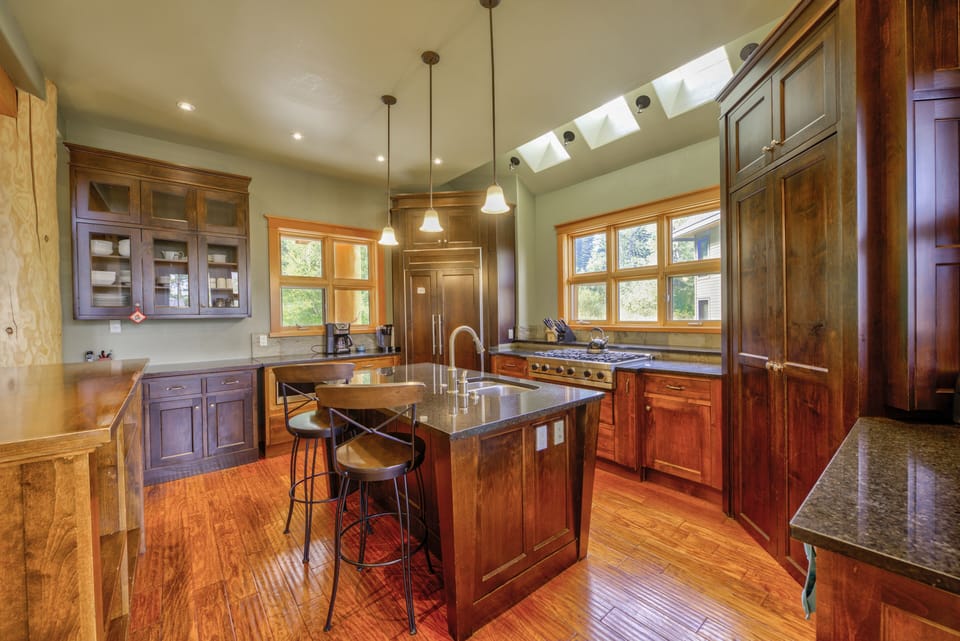 Kitchen with 6 burner viking stove, built in refrigerator and dishwasher
