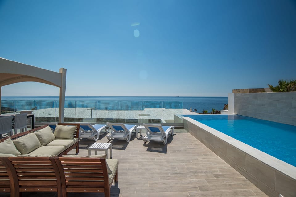 Outdoor Area whipped with; sun loungers, sofa, table, chairs, barbecue & Gazebo