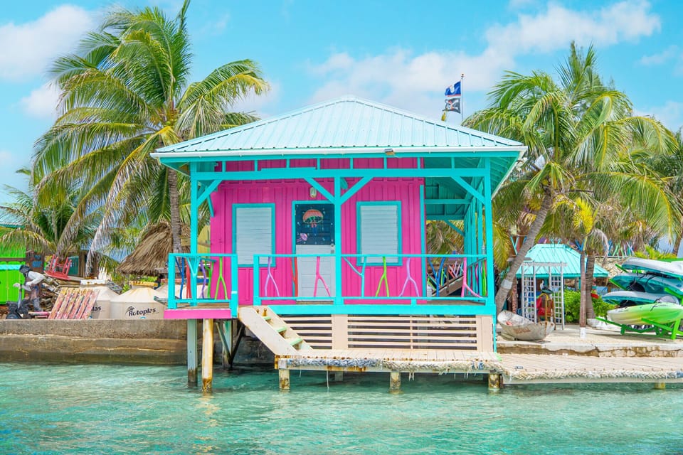 Private overwater accommodations surrounded by turquoise waters.