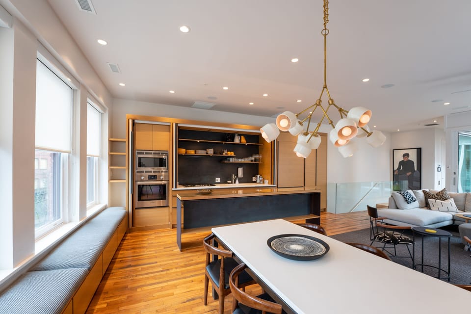 Kitchen and dining area over looking an active downtown three floors below