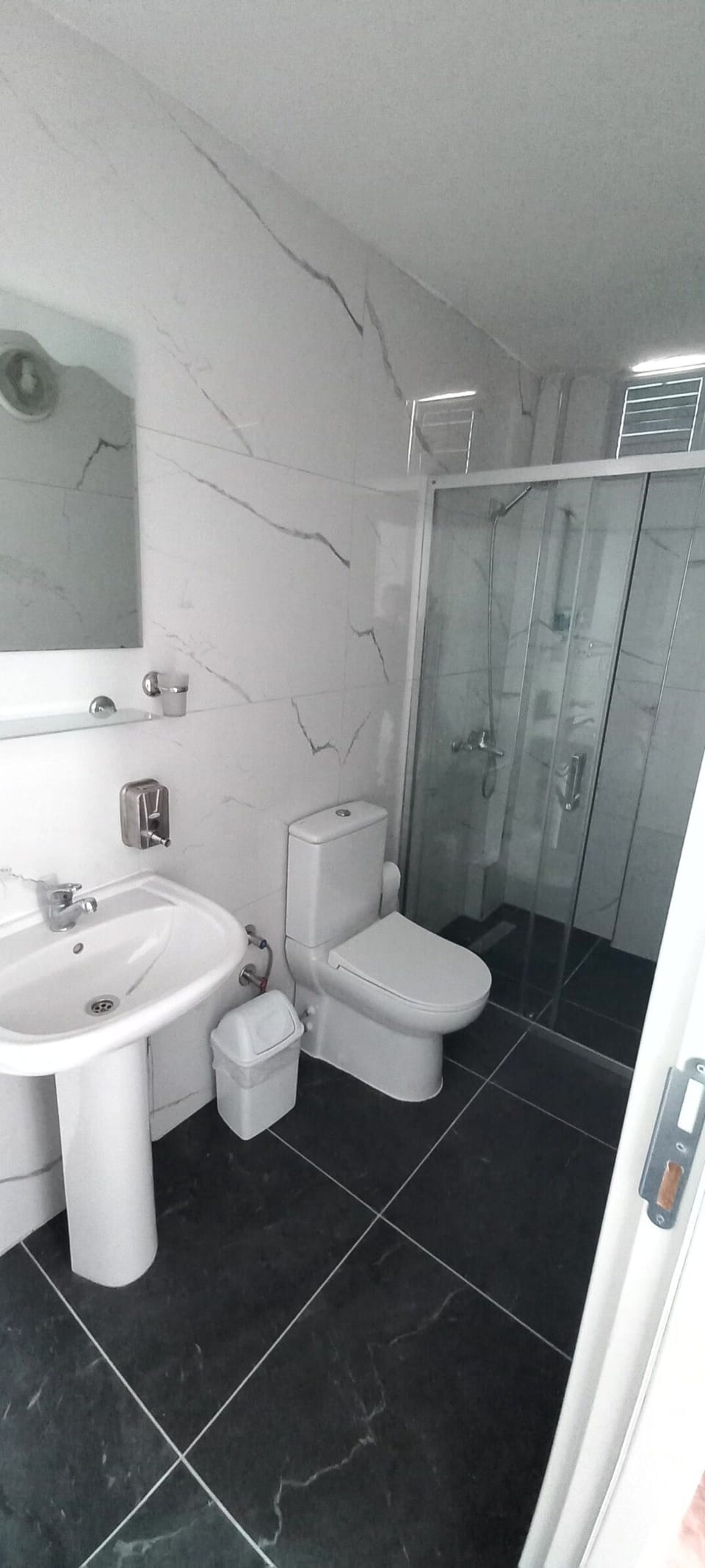 Shower, free toiletries, hair dryer, slippers
