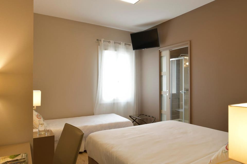 Standard Triple Room, Park View | Desk, blackout drapes, soundproofing, free WiFi