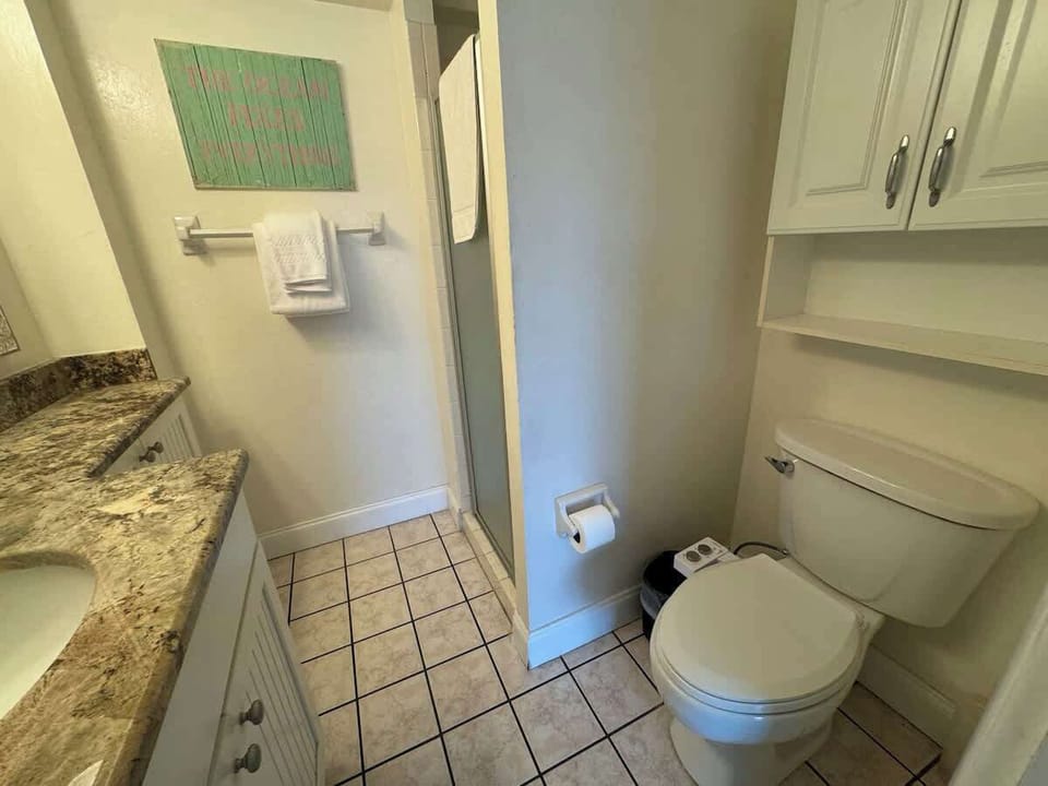 Updated en suite master bath with comfort-height granite counter top.