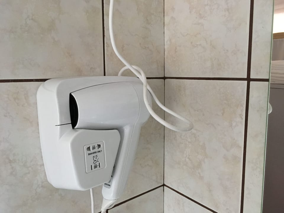 Economy Room (Room 1) | Bathroom | Shower, hair dryer, towels, soap