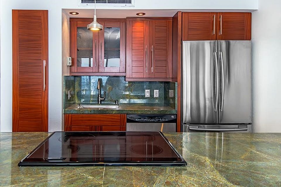 Updated Kitchen with Asian Mahogany cabinets.
