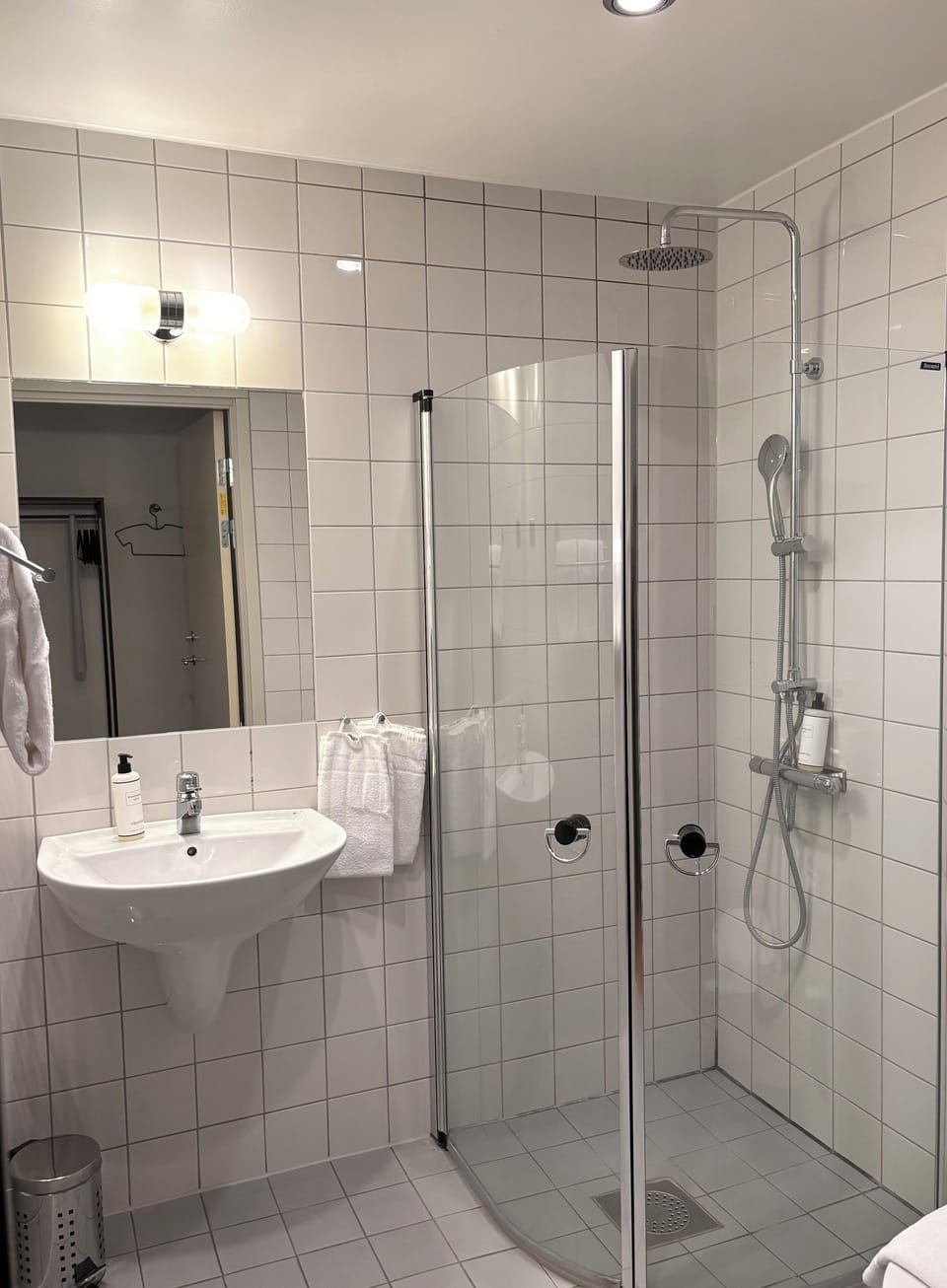 Shower, designer toiletries, hair dryer, towels