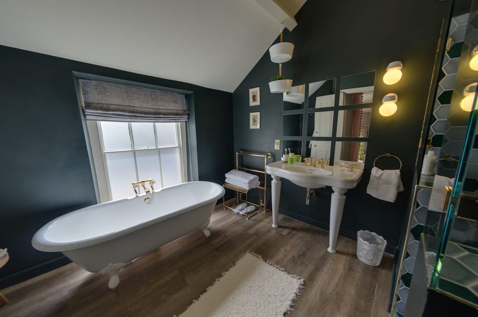 Designer toiletries, hair dryer, bathrobes, slippers