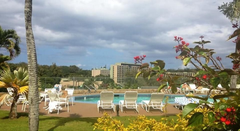 Heated salt brine fresh water pool area with lounge chairs.